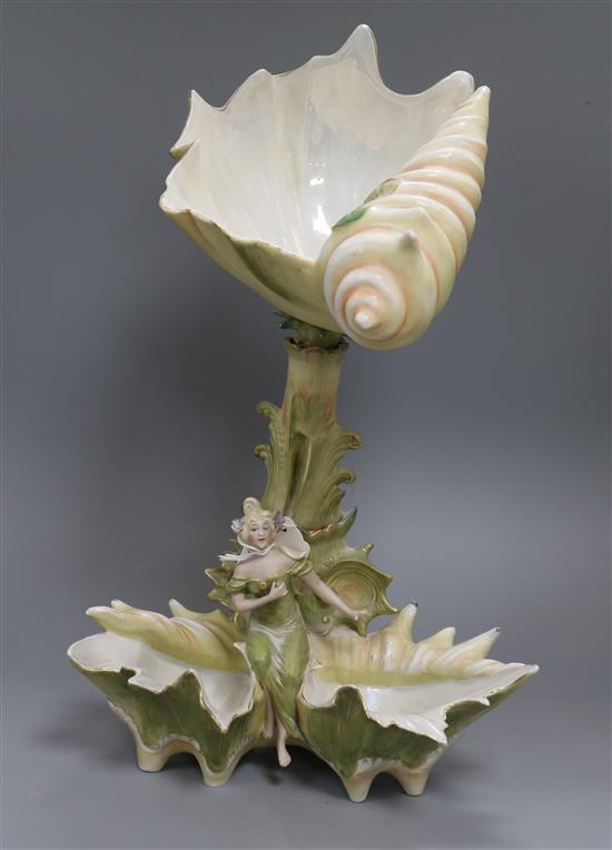 A bisque figurative shell shape centrepiece height 42.5cm